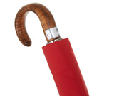 Teleskopischer roter Regenschirm