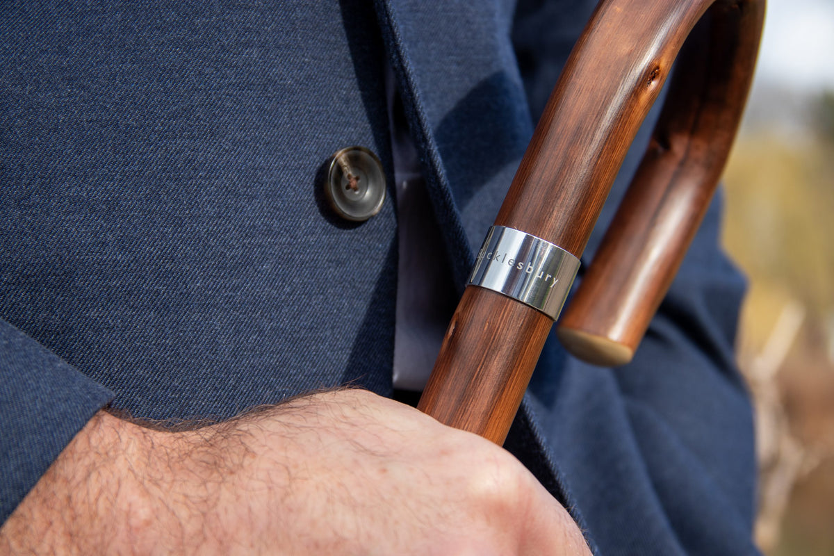 The chestnut handle of a Bucklesbury London Umbrella